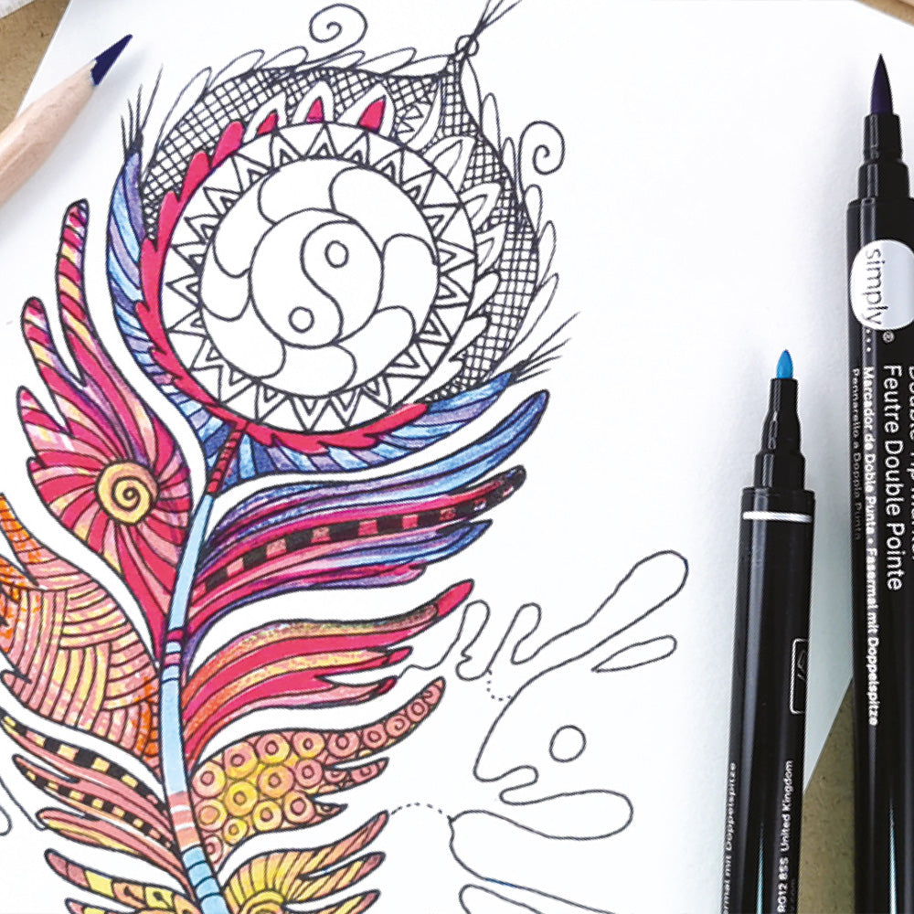 Coloring book page with mandala design and markers on a white background