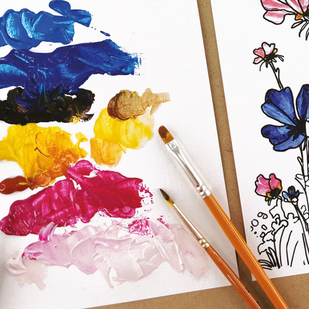 Colour swatches with paintbrushes and a floral drawing on a white background