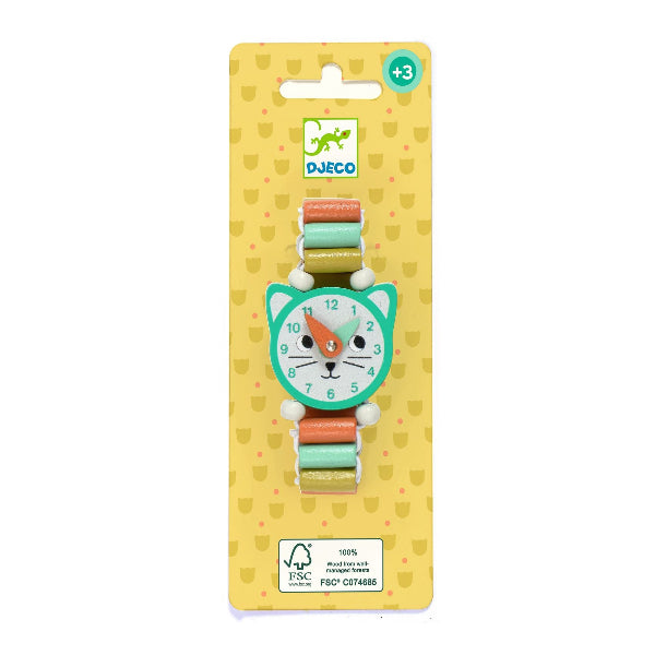 DJECO cat-shaped watch on a yellow patterned retail card, featuring a mint green cat face dial with white, orange, and black details, and a pastel multicolor strap.