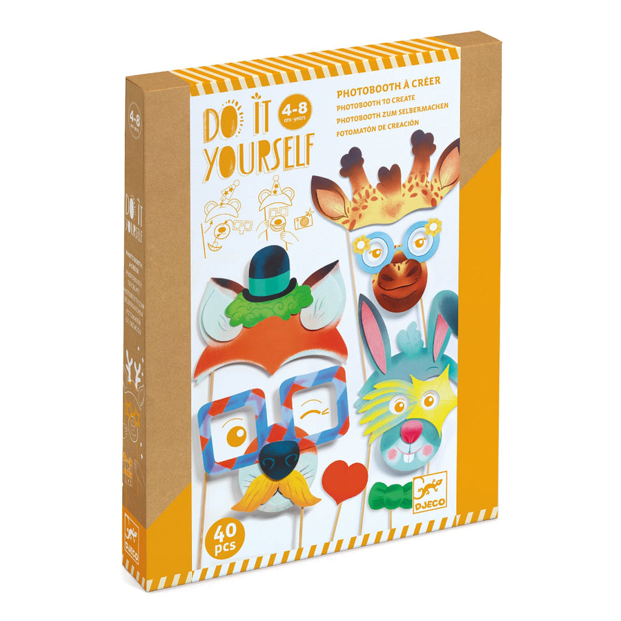 Box of 'Do It Yourself' photo booth props with colorful animal masks on a white background