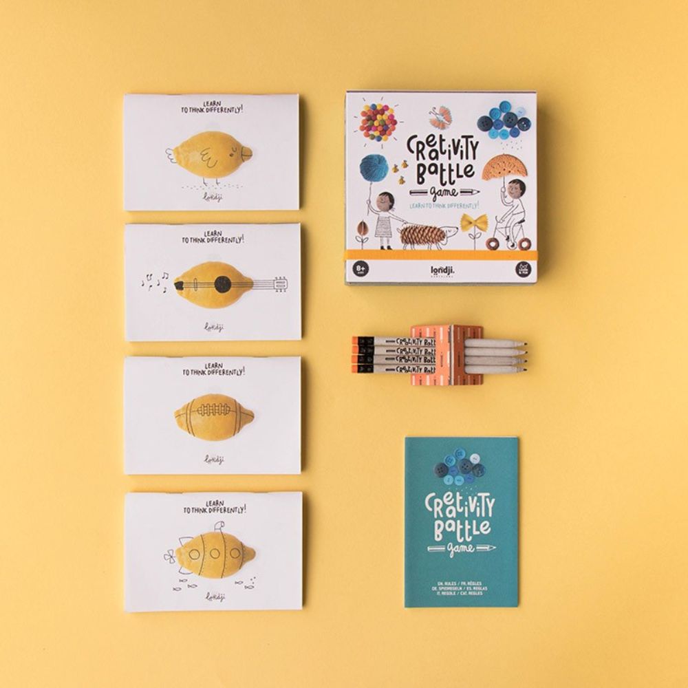 Kids playing a creative drawing storytelling card game by Londji
