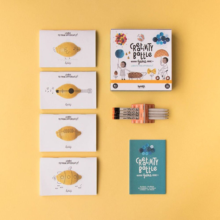 Kids playing a creative drawing storytelling card game by Londji